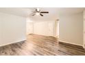 Spacious living room features stylish flooring and access to multiple rooms at 7127 Greenway Sw Cv, Covington, GA 30014