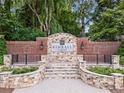 Stone and brick entrance to Kimball Farms community with stone pavers and manicured landscaping surrounding the welcome sign at 1000 Gunter Ct, Alpharetta, GA 30022