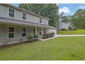 Well-maintained home with a manicured lawn and shrubbery at 5515 Pennybrook Trl, Stone Mountain, GA 30087