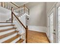 Inviting foyer with hardwood floors, staircase, and decorative trim leading to the upper level at 1324 Concord Sw Cir, Lilburn, GA 30047