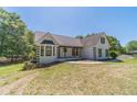 Charming home featuring a white painted brick exterior, black shutters, and a lovely front lawn at 664 Johnson Rd, Oxford, GA 30054