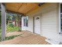 Covered porch with newly added supports and exposed plywood ceiling under renovation at 1406 Allene Sw Ave, Atlanta, GA 30310