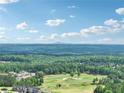 Expansive aerial view overlooking lush greenery and a beautiful golf course at 413 Horizon Trl, Canton, GA 30114