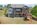 Spacious backyard featuring a multi-level deck with a screened porch, perfect for outdoor entertaining at 413 Horizon Trl, Canton, GA 30114