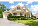 Charming home featuring a well-manicured lawn and lovely, trimmed greenery and sidewalk to the front door at 6186 Talmadge Nw Run, Acworth, GA 30101