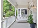 Cozy porch swing, perfect for relaxing, enhances the charm of this inviting outdoor space at 343 Josephine Ne St, Atlanta, GA 30307