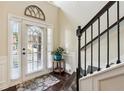 Bright entryway with large glass door, staircase, and views to the outside at 931 Sublime Trl, Canton, GA 30114