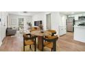 Inviting living space showcasing modern flooring, a dining area and an open flow into the kitchen at 1917 Connally Dr, Atlanta, GA 30344