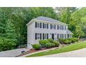 Beautiful two-story home featuring lush landscaping, a manicured lawn, and an attached garage at 2903 Brookshire Way, Duluth, GA 30096