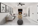 Cozy living room with a fireplace, white walls, and contemporary furniture for a relaxing ambiance at 2702 Galaxy Ct, Decatur, GA 30034
