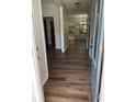 Beautiful entry hallway features hardwood floors and a decorative glass front door at 264 Ascott Ln, Woodstock, GA 30189