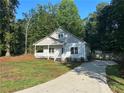 Charming one-story home with a well-manicured lawn and a long driveway at 4720 Fowler Cir, Acworth, GA 30101
