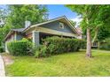 Charming bungalow with blue siding, covered front porch, and a well-maintained lawn at 1639 Rogers Sw Ave, Atlanta, GA 30310