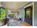 Inviting covered front porch with ample seating and stylish decor at 1639 Rogers Sw Ave, Atlanta, GA 30310