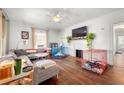 Bright living room with hardwood floors, fireplace, and large windows at 1639 Rogers Sw Ave, Atlanta, GA 30310