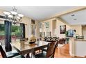 Dining room filled with natural light and hardwood floors at 4335 Burgomeister Pl, Snellville, GA 30039