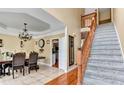 Inviting home entrance with tile flooring and adjacent stairway at 4335 Burgomeister Pl, Snellville, GA 30039