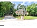 Stunning two-story home with lush landscaping and a spacious driveway, perfect for suburban living at 4335 Burgomeister Pl, Snellville, GA 30039