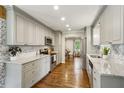 Modern kitchen features granite countertops, stainless steel appliances and ample cabinet space at 687 Monticello Se Way, Marietta, GA 30067