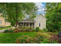 Charming home featuring a screened-in porch and beautifully landscaped yard at 4520 Dallas St, Acworth, GA 30101