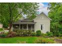 Charming home featuring a screened-in porch and beautifully landscaped yard at 4520 Dallas St, Acworth, GA 30101