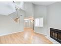 Spacious living room with hardwood floors, fireplace, and soaring ceilings at 1301 Parkaire Xing, Marietta, GA 30068