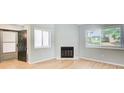 Inviting living area featuring a cozy fireplace, neutral paint, and hardwood floors at 1301 Parkaire Xing, Marietta, GA 30068