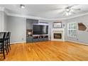 Bright living room boasts a fireplace, hardwood floors, and neutral wall color at 406 Heritage Park Nw Trce # 22, Kennesaw, GA 30144