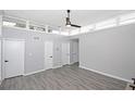 Spacious bedroom with sleek, gray floors, white walls, and modern ceiling fan at 346 Carpenter Drive Northeast Dr # 32, Sandy Springs, GA 30328