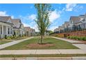 Well-manicured community with sidewalks, green spaces, and charming homes at 513 Godfrey Dr, Cumming, GA 30040