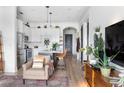 Well-lit kitchen with white cabinets, stainless appliances, an island with seating, and modern design at 625 Piedmont Ne Ave # 3029, Atlanta, GA 30308