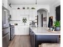 Modern kitchen featuring stainless steel appliances, white cabinets, and a stylish island at 625 Piedmont Ne Ave # 3029, Atlanta, GA 30308