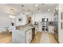 Contemporary kitchen features granite countertops, stainless steel appliances, and modern lighting fixtures at 2795 Peachtree Rd # 1305, Atlanta, GA 30305