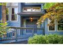 Inviting front porch with a double-door entrance, complemented by lush landscaping and mature trees at 3531 Evans Ridge Dr, Atlanta, GA 30341