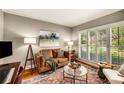 Comfortable living room featuring hardwood floors, plantation shutters, and stylish furnishings at 6211 Traymore Se Trce, Smyrna, GA 30082