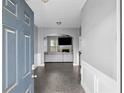 Inviting foyer with tile flooring leading to a spacious living area at 133 Worthing Ln, Fairburn, GA 30213