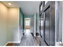 A look inside the home's entryway, featuring hardwood floors and neutral-toned walls at 3755 Greentree Dr, Decatur, GA 30032