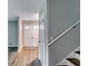 Bright entryway featuring hardwood floors, leading to a white paneled door with window panes at 3755 Greentree Dr, Decatur, GA 30032