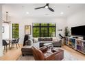 Inviting living room boasting stylish furnishings, large windows, and contemporary ceiling fan at 417 E College Ave # 302, Decatur, GA 30030