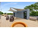 Spacious rooftop deck featuring outdoor seating, shade canopies, and recreational pool for relaxation at 417 E College Ave # 302, Decatur, GA 30030