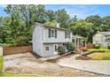 Charming two-story home featuring a cozy front porch and side yard at 4835 Kellys Mill Nw Dr, Lilburn, GA 30047