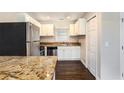 Modern kitchen with granite countertops and stainless steel appliances at 1856 Austell Sw Cir, Marietta, GA 30060