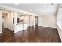 Open living area featuring hardwood floors, and modern white trim throughout at 1856 Austell Sw Cir, Marietta, GA 30060