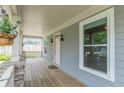 Inviting covered porch showcases wood flooring and stone accents at 3404 Orchard St, Hapeville, GA 30354
