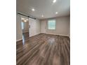 The living room features wood-look flooring, neutral paint and a doorway with a modern, white barn door at 1341 Se Joyner Se Ave, Marietta, GA 30060