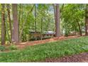 Charming brick home nestled among mature trees and lush landscaping on a beautiful lot at 620 Amberidge Trl, Atlanta, GA 30328