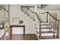 Bright entryway featuring a staircase with wood and white trim, and a view into other rooms at 2973 Payton Ne Rd, Atlanta, GA 30345