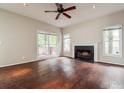 Bright living room boasts hardwood floors, a fireplace, and sliding glass doors leading to the outside at 641 Ira Sw St, Atlanta, GA 30312