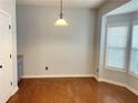 Bright dining area with hardwood floors and a bay window that provides natural light at 795 Abbotts Mill Ct # 73, Johns Creek, GA 30097