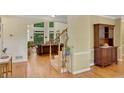Elegant foyer with hardwood floors, staircase, and views into the formal living area at 3245 Bywater Trl, Roswell, GA 30075